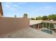 Enjoy the rooftop terrace with seating overlooking the pool and trees beyond the fence at 3774 Decade St, Las Vegas, NV 89121
