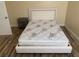 Cozy bedroom with updated floors, bedside table, and a new mattress at 4454 Bertram Ln, Las Vegas, NV 89147