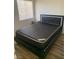 Bedroom with new mattress, bedside table, and a large window with blinds at 4454 Bertram Ln, Las Vegas, NV 89147
