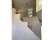 Bright, neutral interior view showing stairway and railing to the second story at 4454 Bertram Ln, Las Vegas, NV 89147