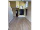 Spacious living room featuring hardwood floors, high ceilings, and large windows at 4454 Bertram Ln, Las Vegas, NV 89147