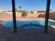 Backyard oasis with a built-in swimming pool, raised spa, and privacy fence at 4454 Bertram Ln, Las Vegas, NV 89147