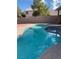 Inviting in-ground swimming pool with spa in fenced backyard, ready for warm-weather fun and relaxation at 4454 Bertram Ln, Las Vegas, NV 89147