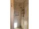 Tiled shower with dual shower heads, built-in niche, and pebble accents at 4454 Bertram Ln, Las Vegas, NV 89147