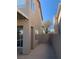 Side yard showcasing a private walkway and secure gated access to backyard at 4454 Bertram Ln, Las Vegas, NV 89147