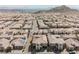 Aerial view of a residential neighborhood with similar style homes and mountain backdrop at 4576 Amazing View St, Las Vegas, NV 89129