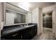 Elegant bathroom features granite countertop vanity, large mirror, and modern finishes at 4576 Amazing View St, Las Vegas, NV 89129