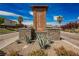 Entrance to The Views at Hidden Hills, featuring lush landscaping and community signage at 4576 Amazing View St, Las Vegas, NV 89129