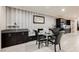 Dining area with modern table and chairs, designer wallpaper, and built-in bench seating at 4576 Amazing View St, Las Vegas, NV 89129