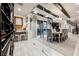 Elegant dining room with chandelier, glass wall, and wine storage at 4576 Amazing View St, Las Vegas, NV 89129