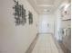 An inviting entryway with modern art and tile flooring at 4576 Amazing View St, Las Vegas, NV 89129