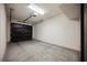 A spacious garage with epoxy flooring and an automatic door creates an organized area at 4576 Amazing View St, Las Vegas, NV 89129