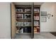 Garage storage closet with open doors reveals an abundance of organized household items on shelves at 4576 Amazing View St, Las Vegas, NV 89129