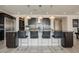 This kitchen features a center island with seating, stainless appliances, and stylish pendant lighting at 4576 Amazing View St, Las Vegas, NV 89129