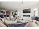 Relaxing living room features tile flooring, comfortable seating, a fireplace, and an open layout at 4576 Amazing View St, Las Vegas, NV 89129