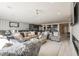 Spacious living room featuring modern decor, fireplace, and seamless flow into the kitchen at 4576 Amazing View St, Las Vegas, NV 89129