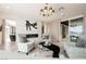 Bright living room with fireplace, comfortable seating, and sliding glass doors to the outside at 4576 Amazing View St, Las Vegas, NV 89129