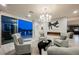 Cozy living room with fireplace and comfortable seating, with sliding doors to the pool area at 4576 Amazing View St, Las Vegas, NV 89129