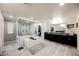 Luxurious bathroom featuring dual vanities, a freestanding tub, and a glass-enclosed shower with stylish tile at 4576 Amazing View St, Las Vegas, NV 89129