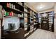 Spacious walk-in pantry with custom shelving, beverage station, and organized storage at 4576 Amazing View St, Las Vegas, NV 89129