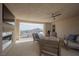 Comfortable patio features a fireplace, seating, ceiling fan, and a stunning mountain view at 4576 Amazing View St, Las Vegas, NV 89129