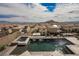 A stunning backyard pool and hot tub, perfect for outdoor entertaining, overlook the city at 4576 Amazing View St, Las Vegas, NV 89129