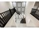 Grand staircase illuminated by a modern chandelier, creating an open and airy atmosphere at 4576 Amazing View St, Las Vegas, NV 89129