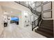 Elegant staircase leading to the upper level, with stylish lighting and modern design at 4576 Amazing View St, Las Vegas, NV 89129