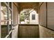 A private balcony with textured walls offers a cozy outdoor retreat with views of the neighboring building at 4742 Obannon Dr # D, Las Vegas, NV 89102