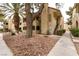 Beautiful condo exterior with desert landscaping, mature trees, and convenient walkway access at 4742 Obannon Dr # D, Las Vegas, NV 89102