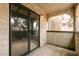 Cozy balcony featuring sturdy concrete, a sliding glass door, and view of the neighborhood at 4742 Obannon Dr # D, Las Vegas, NV 89102
