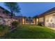 Lush backyard with mature landscaping, built-in patio, providing the perfect space for entertaining and relaxation at 48 Panorama Crest Ave, Las Vegas, NV 89135