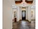 Spacious foyer with stone tile flooring, a decorative front door, and ample natural light at 48 Panorama Crest Ave, Las Vegas, NV 89135