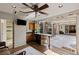 Indoor-outdoor kitchenette with island, breakfast bar, and exterior access to the patio at 48 Panorama Crest Ave, Las Vegas, NV 89135