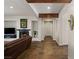 Elegant living room with fireplace, dark-toned tile flooring and stylish decor at 48 Panorama Crest Ave, Las Vegas, NV 89135