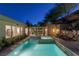 Tranquil backyard pool with waterfall feature, lush landscaping, and inviting design at 48 Panorama Crest Ave, Las Vegas, NV 89135