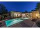 Beautiful backyard pool and spa with lush greenery and elegant stone accents at 48 Panorama Crest Ave, Las Vegas, NV 89135