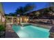 Stunning backyard pool and spa with stone accents and lush landscaping at 48 Panorama Crest Ave, Las Vegas, NV 89135