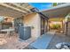 Paver patio and AC unit with gravel area and shade covering at 501 Starfire Pl, Las Vegas, NV 89107