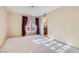 Inviting bedroom featuring a large window and a neutral color palette at 501 Starfire Pl, Las Vegas, NV 89107