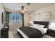 Comfortable bedroom featuring a ceiling fan, shelving and generous natural light at 501 Starfire Pl, Las Vegas, NV 89107