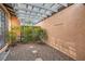 Private courtyard with gravel, rock, and paver detail, plants, and shaded covering at 501 Starfire Pl, Las Vegas, NV 89107