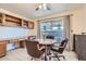 Bright dining area with built-in cabinets, tile floor, and backyard access at 501 Starfire Pl, Las Vegas, NV 89107