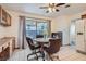 Cozy eat-in kitchen with a ceiling fan, tile flooring, table, and backyard access at 501 Starfire Pl, Las Vegas, NV 89107
