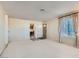 Comfortable living room offering neutral paint, carpet, and natural light from the window at 501 Starfire Pl, Las Vegas, NV 89107