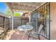 Covered patio with pavers and a table and chairs outside of sliding glass doors at 501 Starfire Pl, Las Vegas, NV 89107