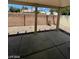 Covered backyard patio area with desert landscaping, offering a relaxed outdoor living space at 5213 Castle Butte Ct, North Las Vegas, NV 89031