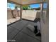 Outdoor patio area providing ample shade, surrounded by desert landscaping for easy maintenance at 5213 Castle Butte Ct, North Las Vegas, NV 89031