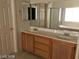 A full bathroom features dual sinks, a tub, and a glass shower at 5213 Castle Butte Ct, North Las Vegas, NV 89031