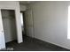 A well-lit bedroom showcases carpet floors and a closet at 5213 Castle Butte Ct, North Las Vegas, NV 89031